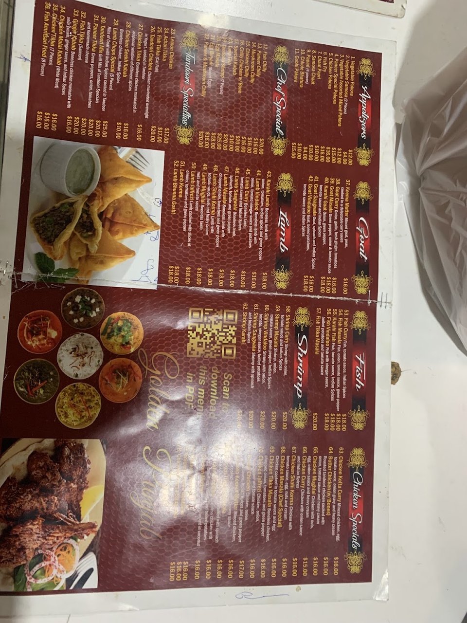 Indian menu showing tandoori, lamb, and chicken dishes.