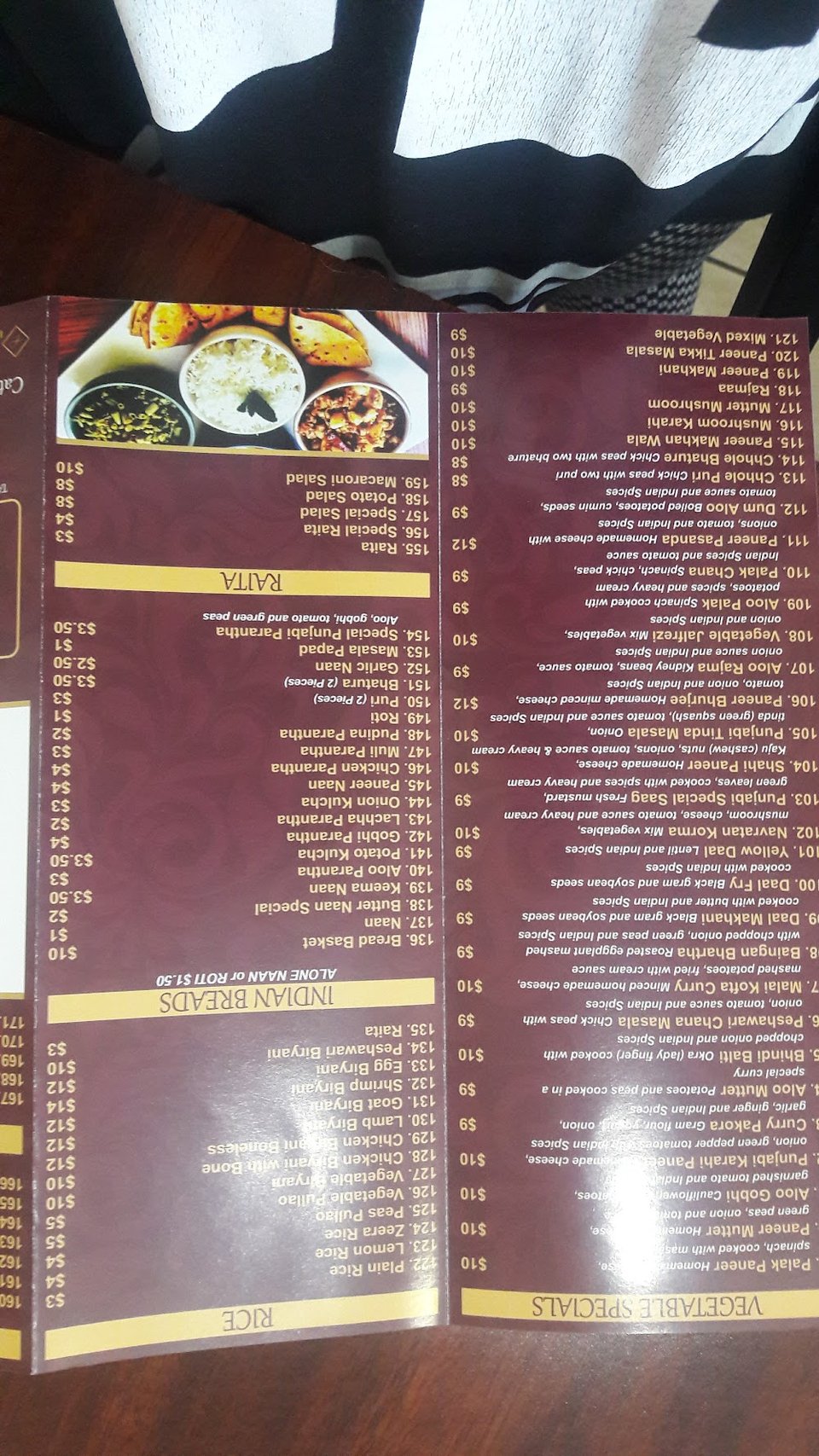 Menu page listing curry and grilled specialties.